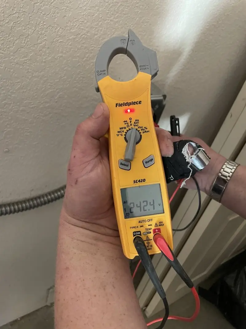 Voltage testing with clamp meter during Whole House Surge Protector in Hibbing